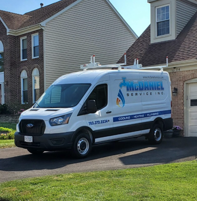 McDaniel van parked in a customer driveway