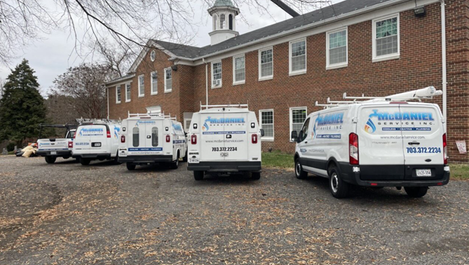 McDaniel van parked in front of a brick building