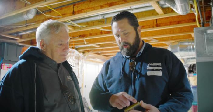 Technician talking to homeowner